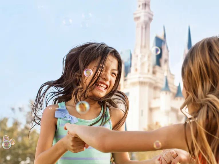 Guests playing with bubbles in Magic Kingdom