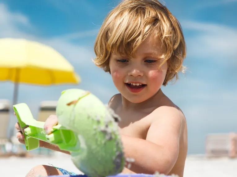 Boy playing on Clearwater Beach in Florida