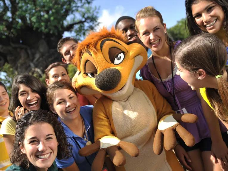 Guests meeting Timon at Disney's Animal Kingdom Theme Park