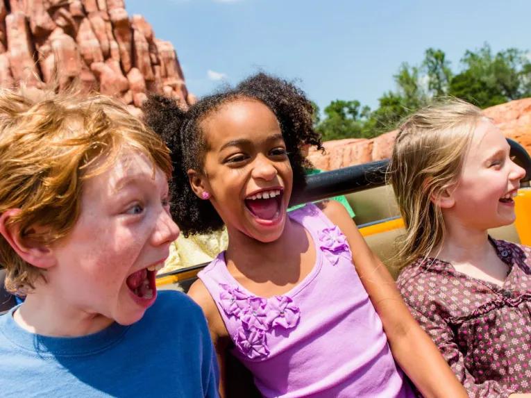 Kids on Big Thunder Mountain Railroad at Magic Kingdom