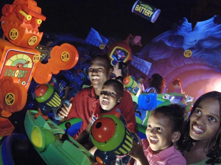 Family enjoying Buzz Lightyear's Space Ranger Spin at Magic Kingdom