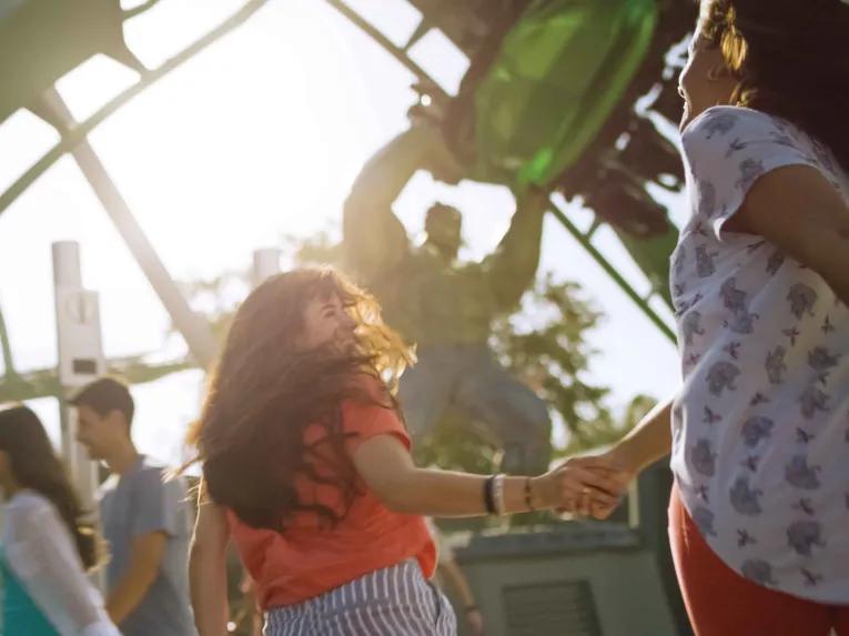 Teens in front of the Hulk Coaster at Universal's Islands of Adventure