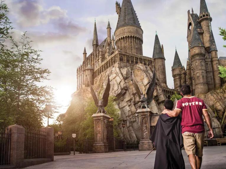 Father and son in front of Hogwarts Castle at Universal's Islands of Adventure