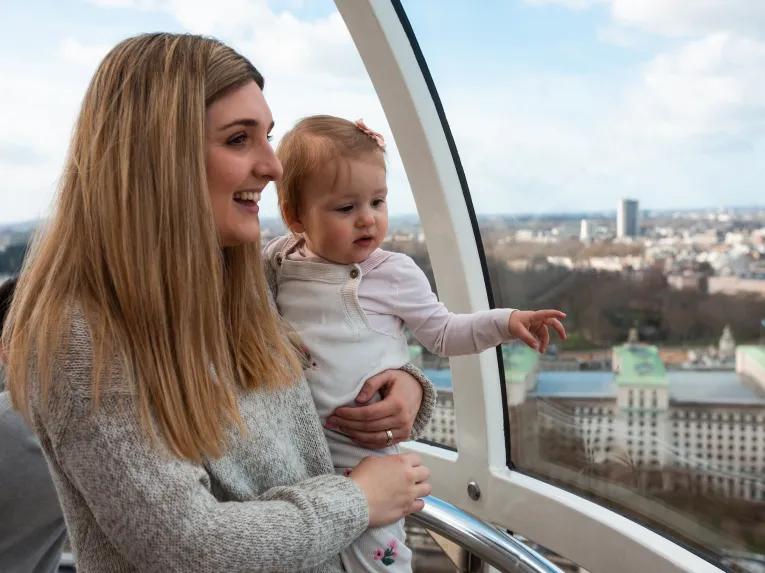 Mother and baby enjoying the views from a London Eye pod