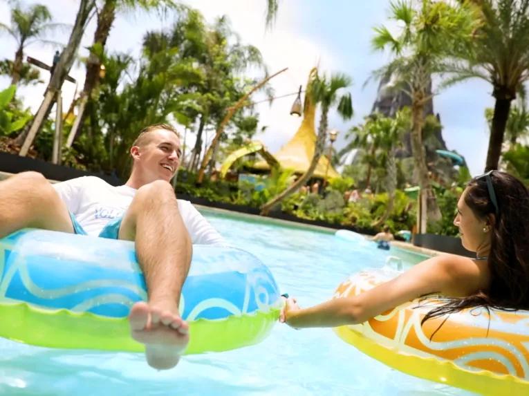 Girls relaxing on Kopiko Wai Winding River at Universal's Volcano Bay Water Theme Park