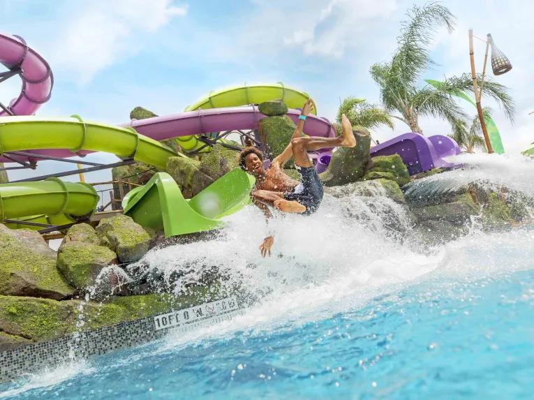 Man on water slide at Universal's Volcano Bay Water Theme Park