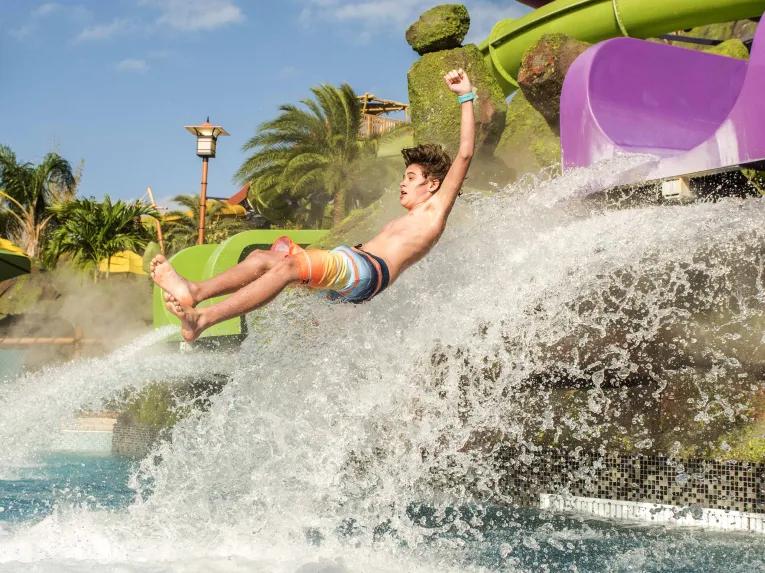 Boy on water slide at Universal's Volcano Bay Water Theme Park