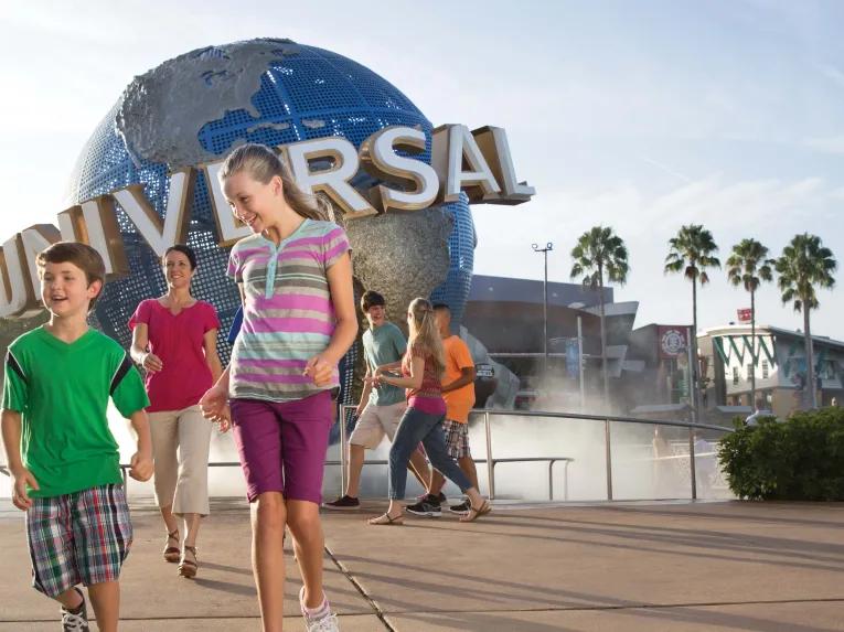 Boy and Girl in front of Universal Globe at Universal Orlando Resort