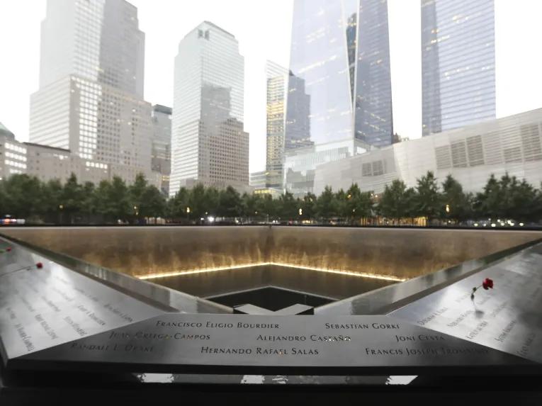 Names of victims of the 2001 and 1993 attacks inscribed into bronze panels surrounding the reflecting pools outside the 9/11 Memorial Museum