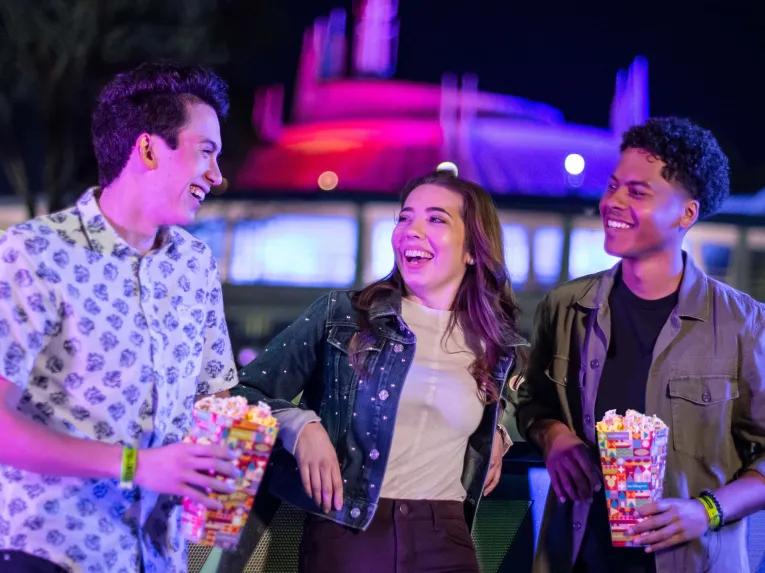 Teens enjoying snacks at Disney After Hours Boo Bash at Magic Kingdom Park