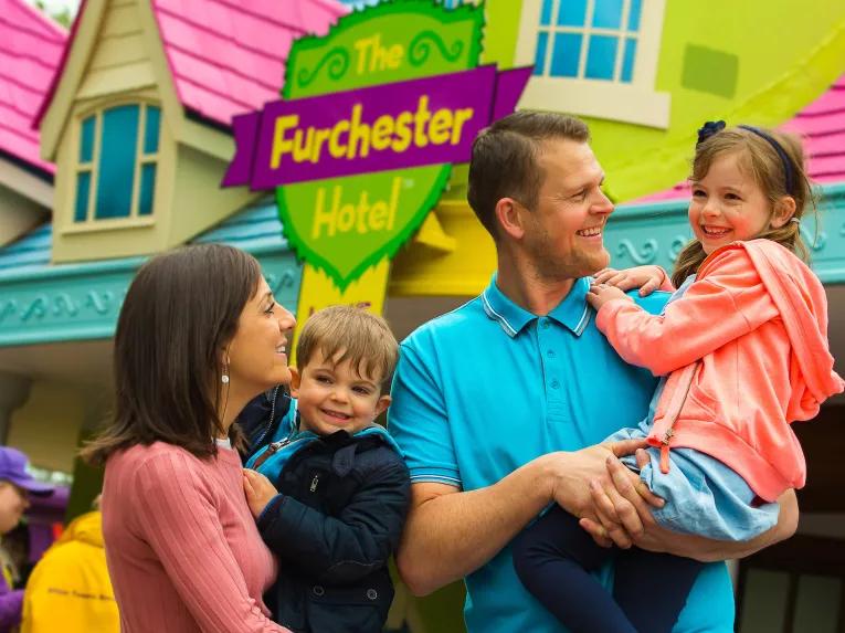 Family outside the Furchester Hotel at Cbeebies land, Alton Towers