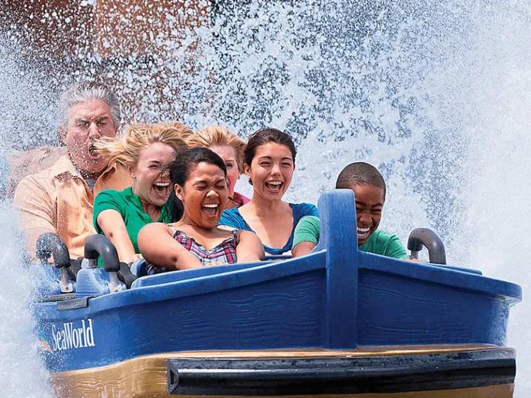 Guests riding Journey to Atlantis at SeaWorld Orlando