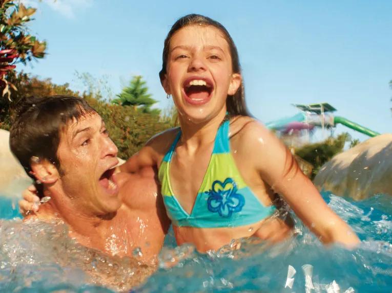 Father and daughter on Roas Rapids at Aquatica Orlando
