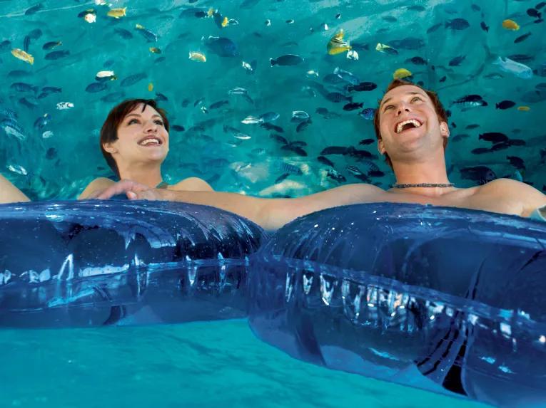 Couple floating along Loggerhead Lane at Aquatica Orlando