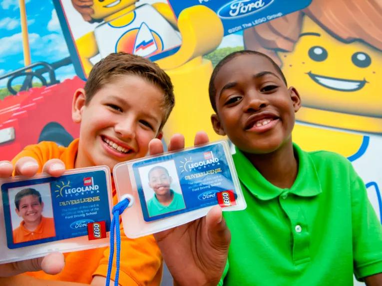 Kids showing off their LEGO driving licenses at LEGOLAND Florida