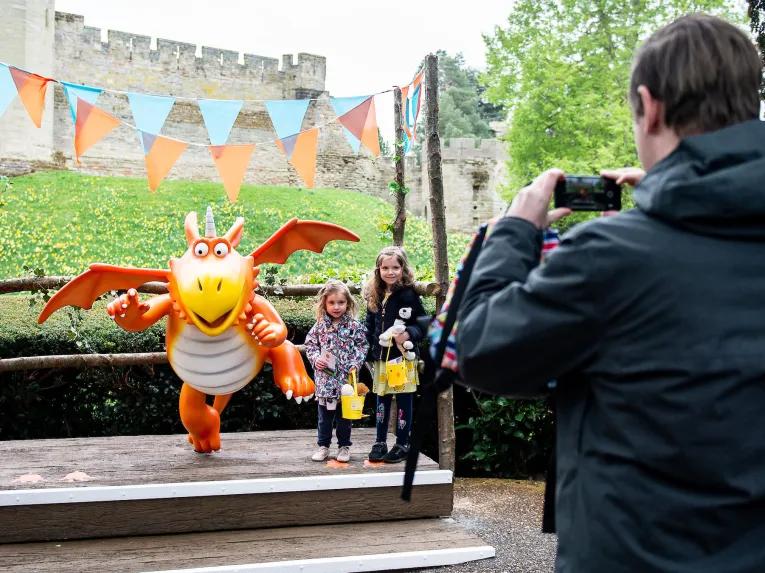 Kids taking photo with Zog the loveable dragon at Warwick Castle