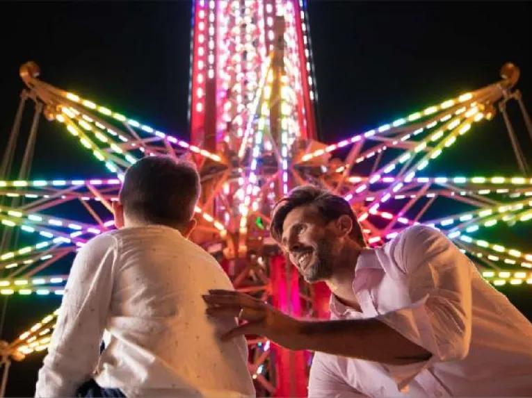 Father and son in front of Bollywood Skyflyer at Bollywood Dubai