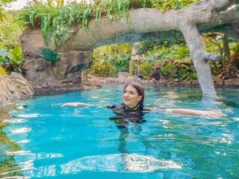 Guests exploring Freshwater Oasis at Discovery Cove