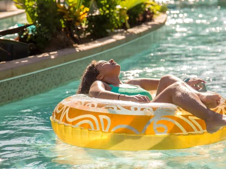 Girl chilling out on the Lazy River at Universal's Volcano Bay