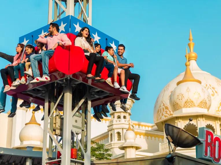 Guests riding Rocket at BOLLYWOOD Parks Dubai
