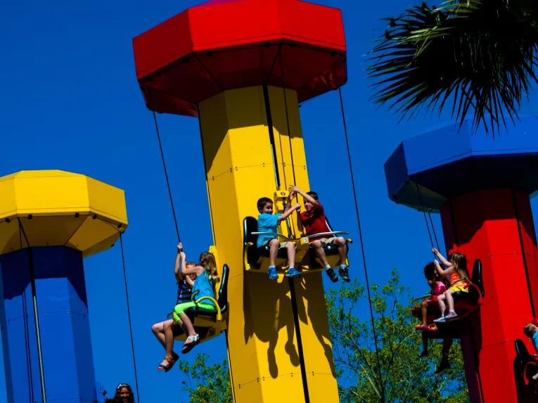 Kids riding Power Towers at LEGOLAND Dubai