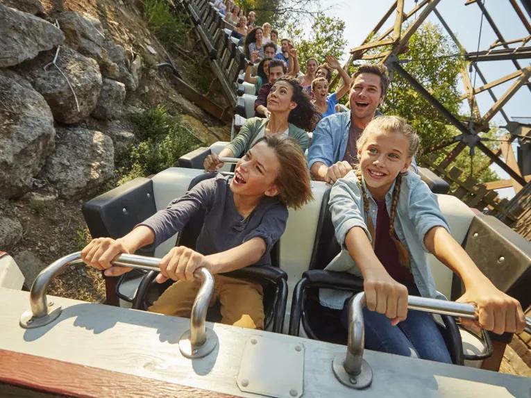 Guests riding El Diablo - Tren de la mina at PortAventura theme park