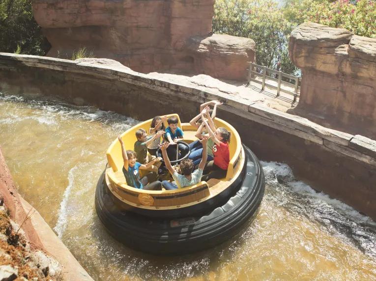 Guests riding Gran Canyon Rapids at PortAventura theme park