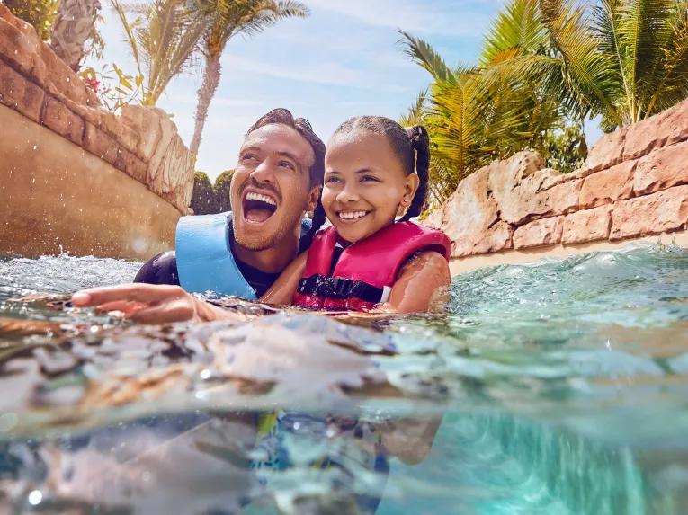 Father and daughter enjoying the raging rapids at Aquaventure Dubai