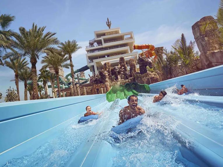 Guest sliding down Hydra Racers at Aquaventure Dubai