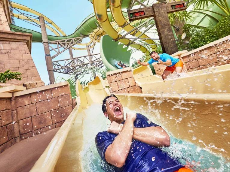 Man riding Slitherine water slide at Aquaventure Dubai