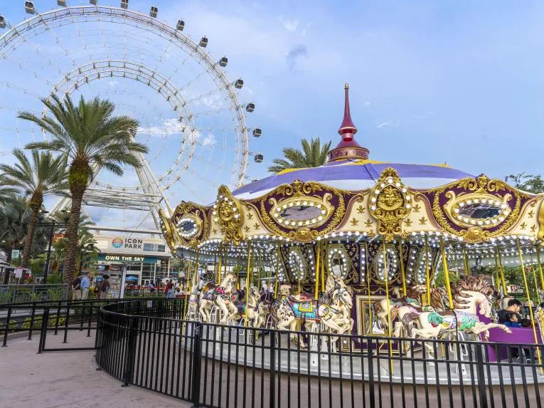 Carousel in front of the Icon Orlando Wheel