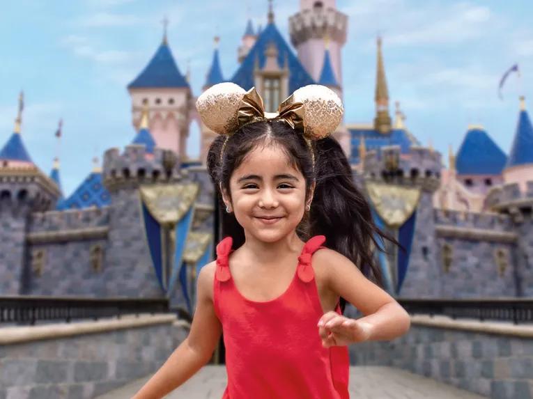 Girl in front of Sleeping Beauty Castle, Disneyland Park in California
