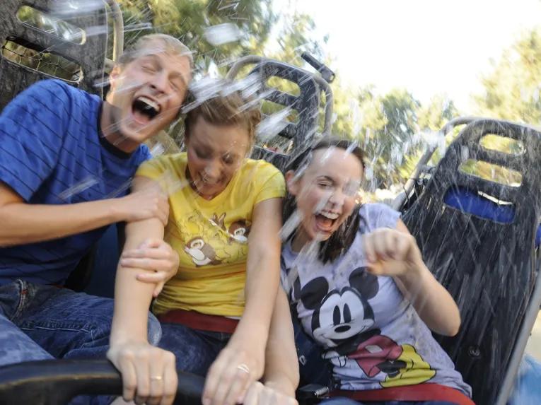 Guests getting wet on Grizzly River Run, Disney California Adventure Park