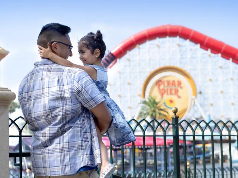Guests in front of Pixar Pier, Disney California Adventure