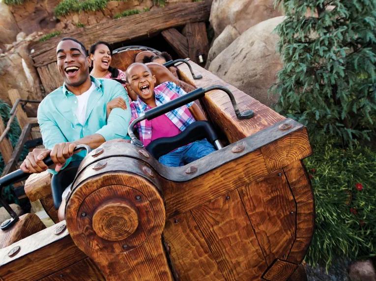 guests on seven dwarfs mine train in magic-kingdom park