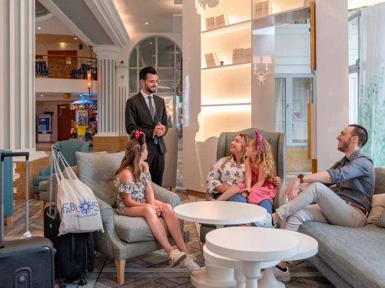Family sitting in the Dream Castle Hotel Paris Lobby Area