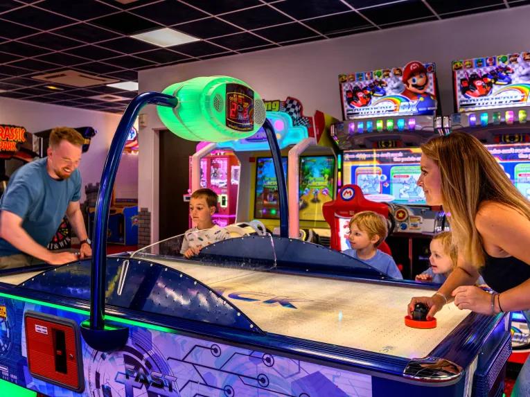 Family in the games room at Explorers Hotel Marne-la-Vallée