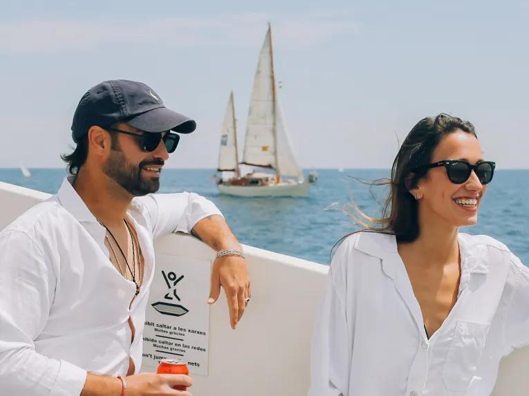 couple-relaxing-on-catamaran