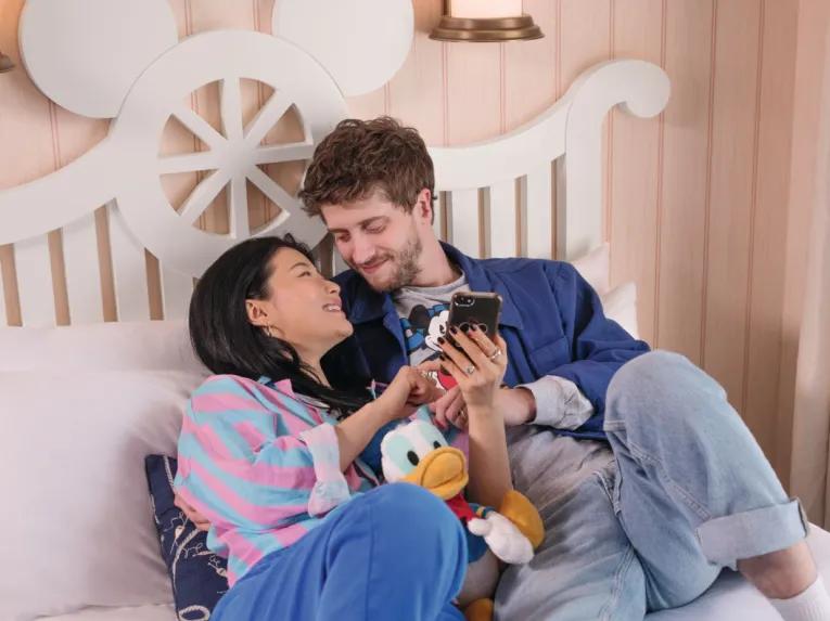 Guests in a Superior Room at Disney Newport Bay Club