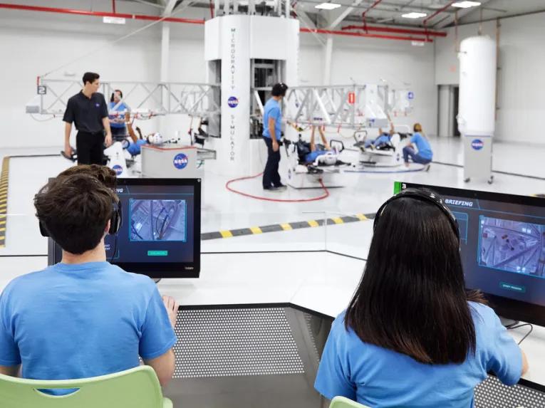 Group working on ATX Microgravity Simulator at Kennedy Space Center Visitor Complex