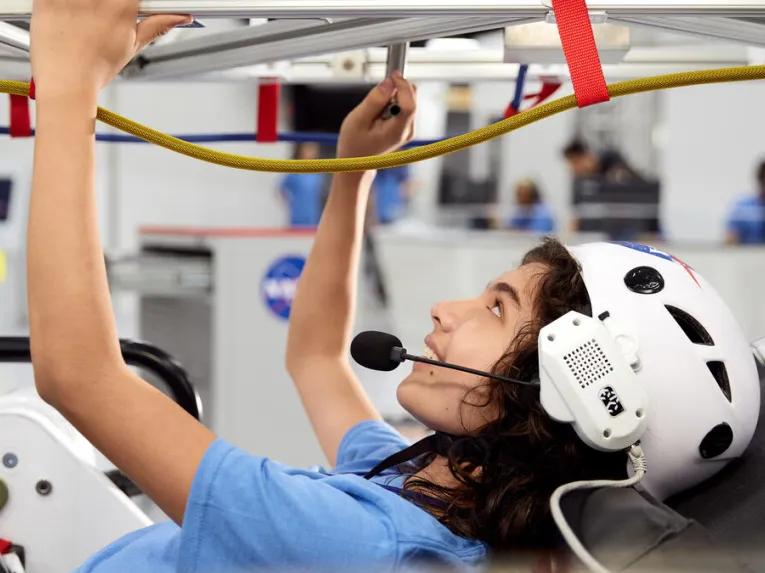 Guest experiencing ATX Microgravity Simulator 5 at Kennedy Space Center Visitor Complex