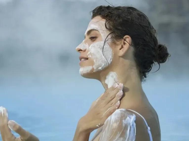 woman-putting-on-mask-cream