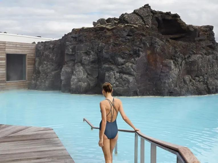 woman-walking-into-pool