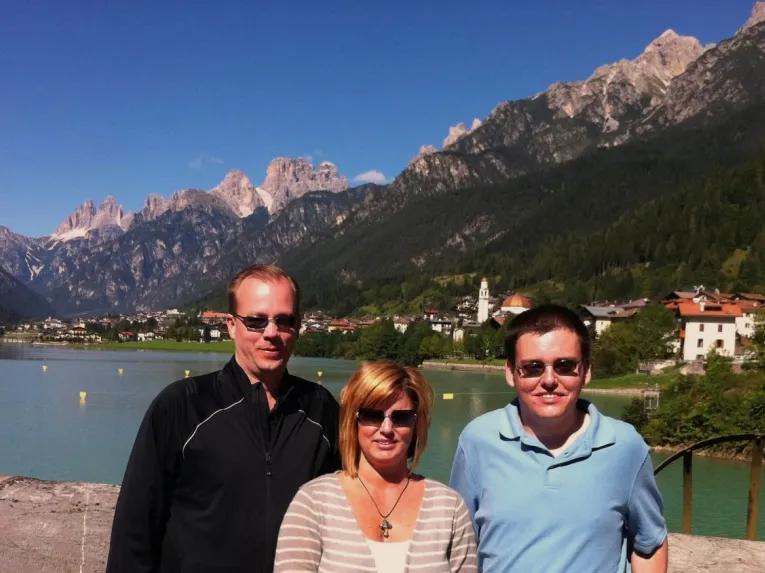 people-by-lake-and-mountain