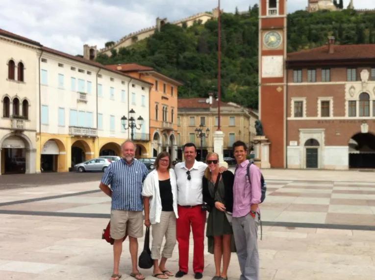 people-posing-for-photo-in-square