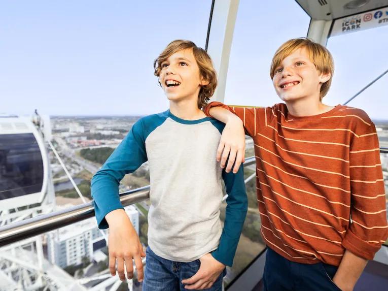 Boys inside an Orlando Eye Capsule