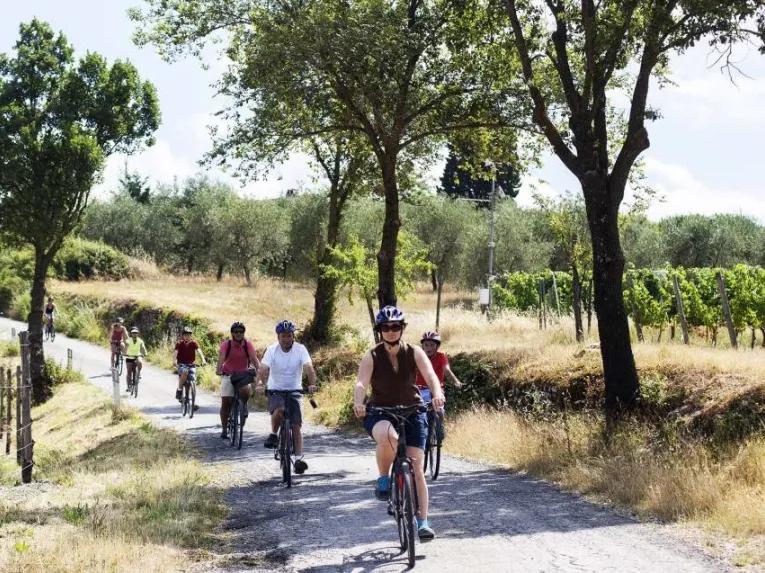 group-riding-through-tuscany