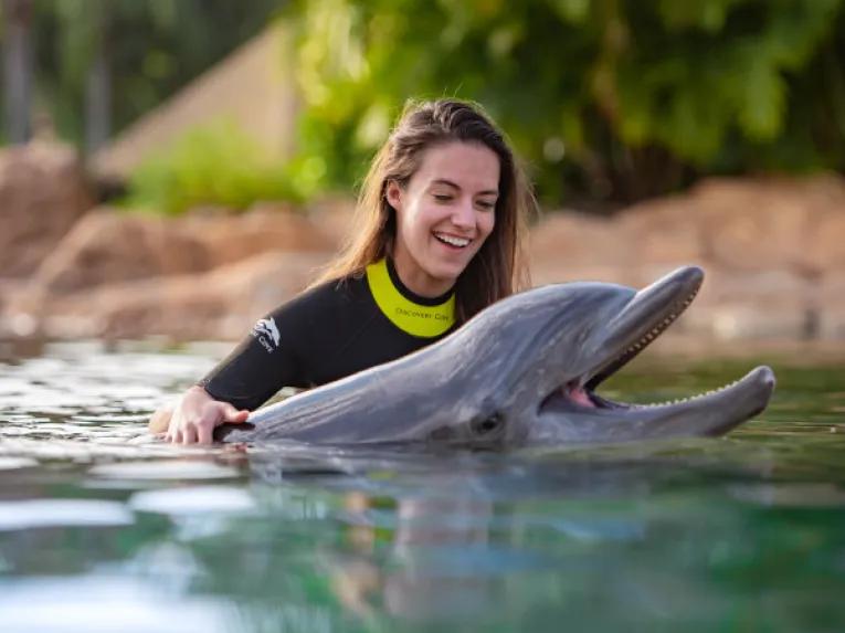 Woman interacting with Dolphin at Discovery Cove Orlando