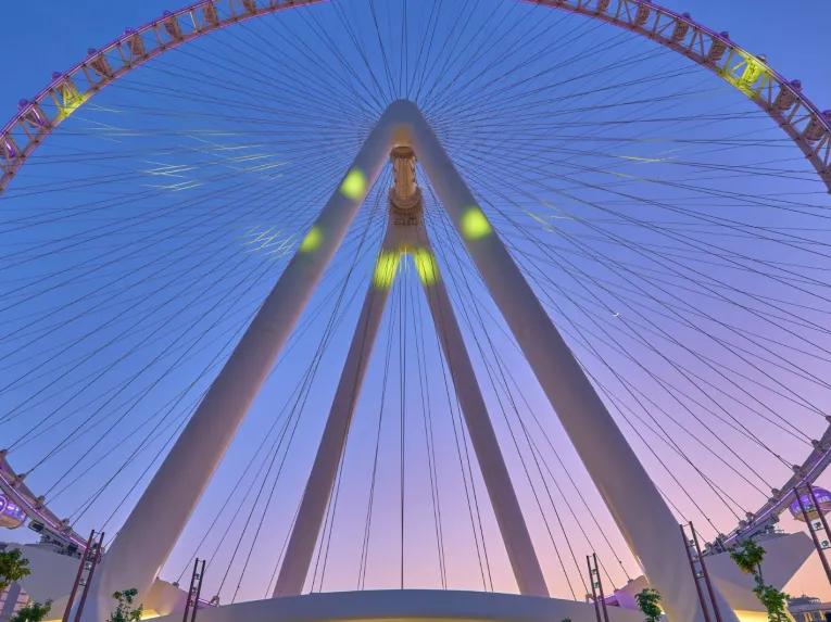 View looking up at Ain Dubai, the towering observation wheel against the sky