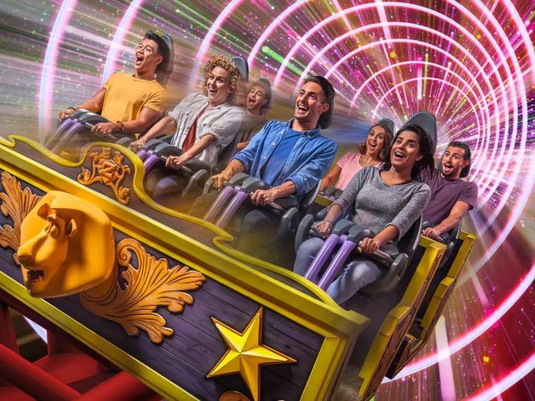 Madagascar Mad Pursuit roller coaster at MOTIONGATE™ Dubai with excited riders